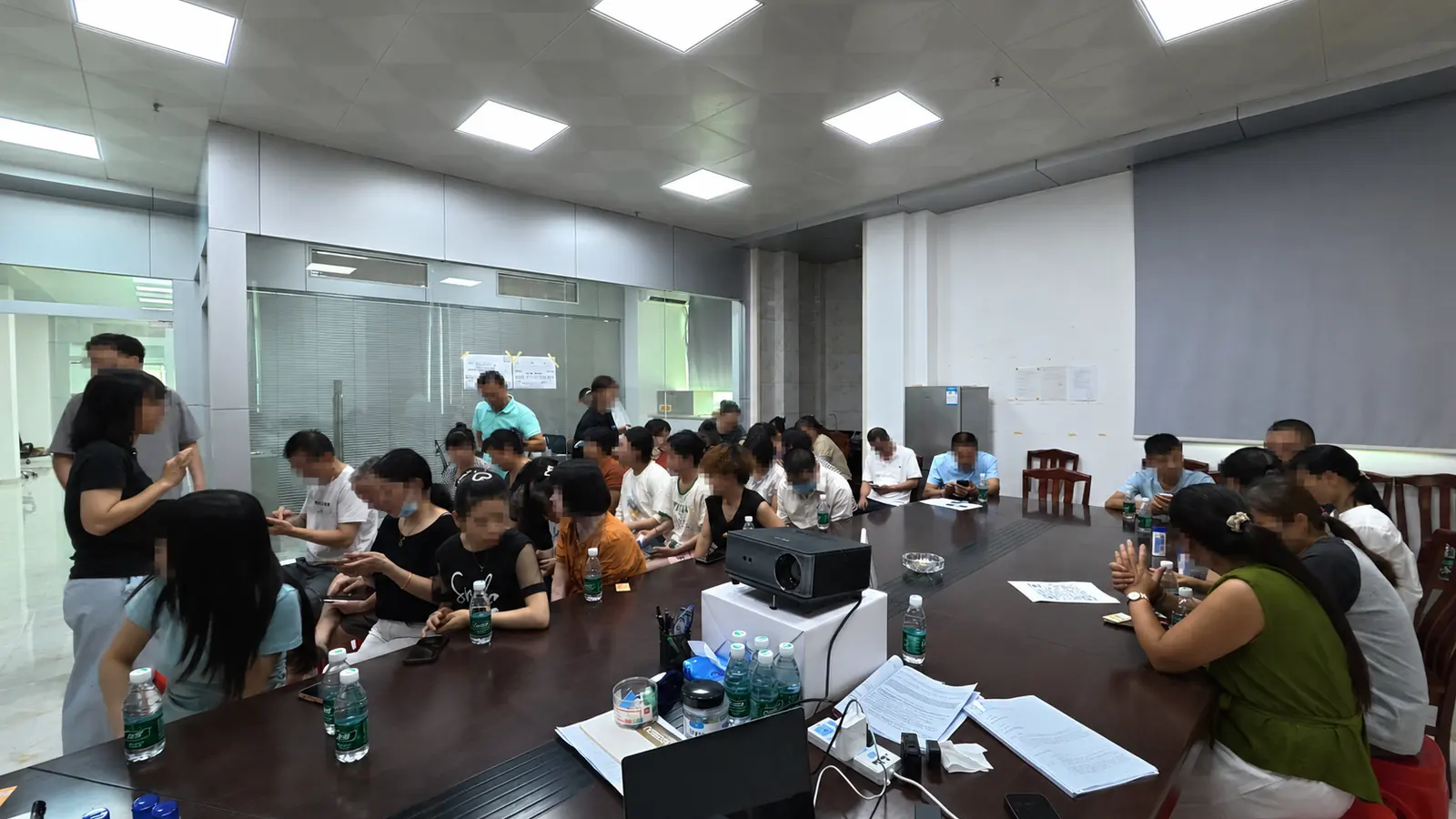 An anonymised group workshop in a factory meeting room