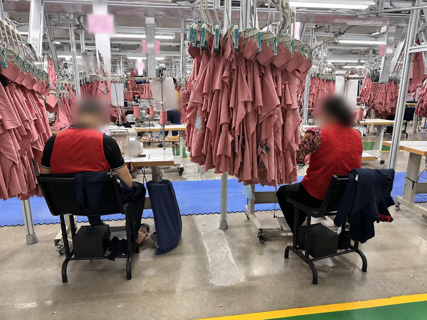 An anonymised view of workers on a garment production floor